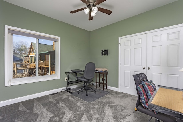 office with carpet floors and ceiling fan