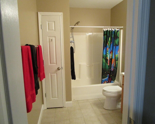 bathroom with toilet, tile patterned flooring, and shower / bath combo with shower curtain