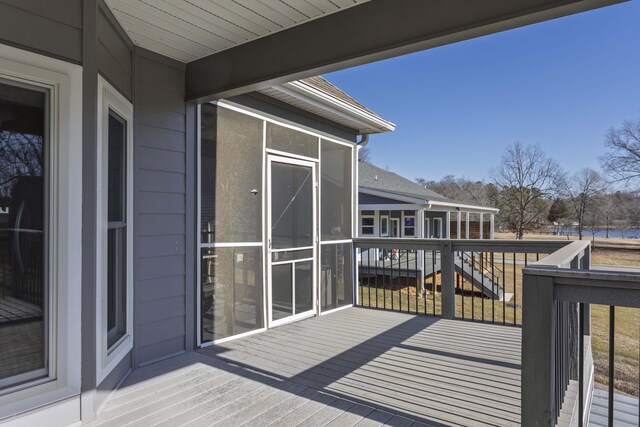 deck with a sunroom