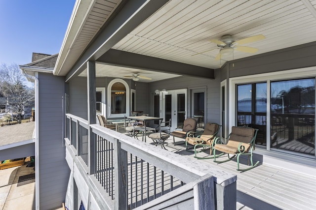 deck featuring french doors and ceiling fan