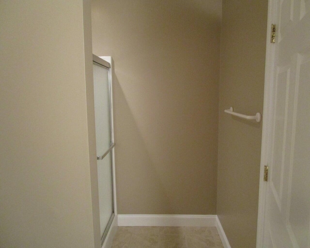 walk in closet featuring light tile patterned floors