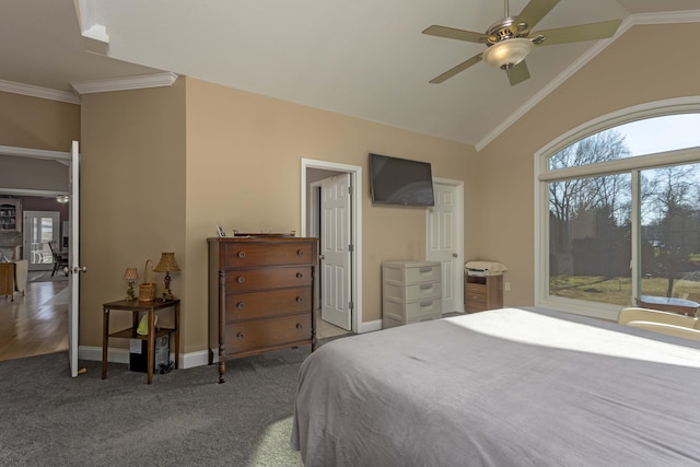 carpeted bedroom with multiple windows, crown molding, lofted ceiling, and access to exterior