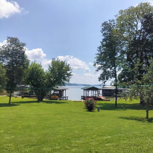 view of yard featuring a gazebo and a water view