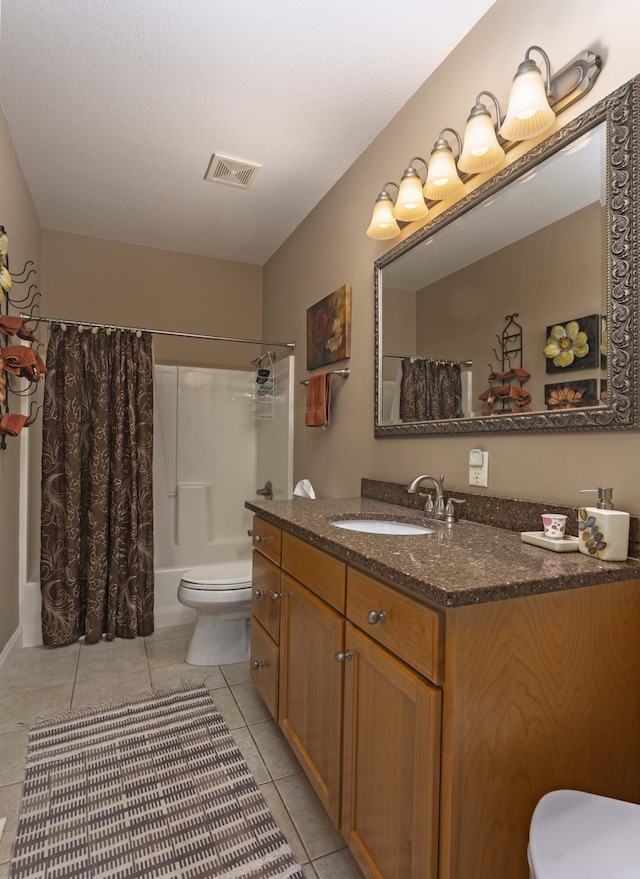 full bathroom with vanity, tile patterned floors, toilet, and shower / bath combo with shower curtain