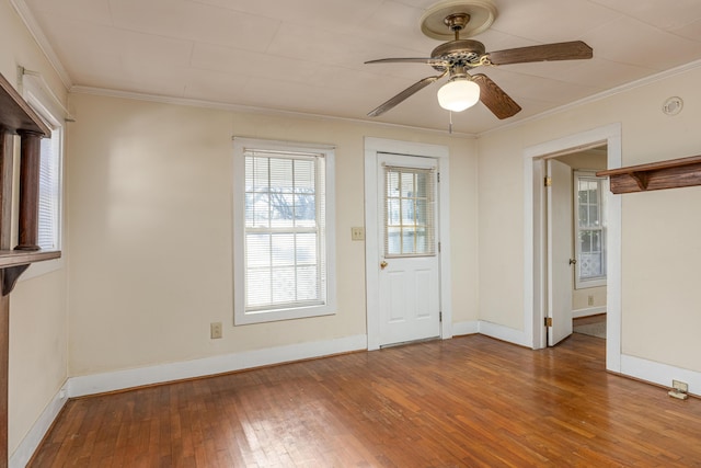 interior space with ceiling fan, hardwood / wood-style floors, and crown molding