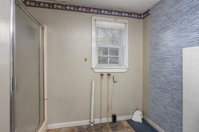 washroom featuring a textured ceiling