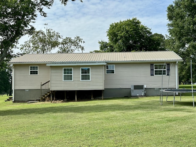 175 Sunset Estates Ln, Dayton, TN 37321 - back of house featuring a trampoline, crawl space, a yard, and metal roof