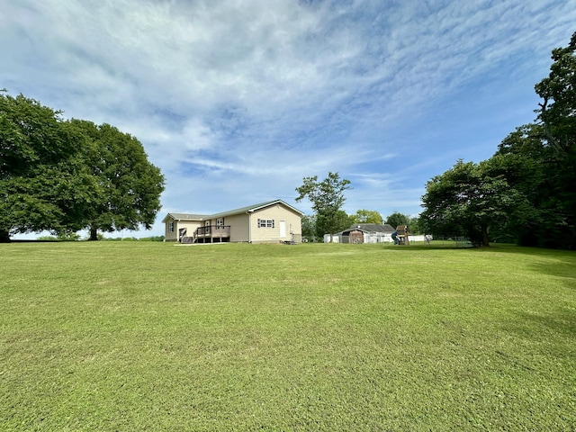 175 Sunset Estates Ln, Dayton, TN 37321 - view of green lawn with a deck