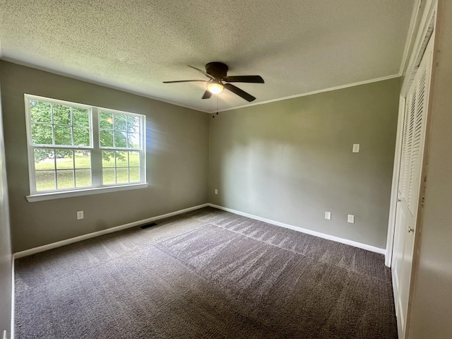 175 Sunset Estates Ln, Dayton, TN 37321 - empty room featuring a ceiling fan, baseboards, dark colored carpet, and a textured ceiling