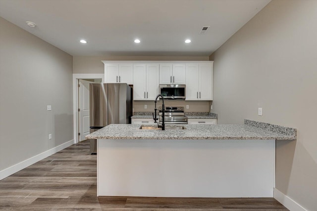 4470 Keith St NW Unit 501, Cleveland, TN 37312 - kitchen featuring appliances with stainless steel finishes, a sink, light stone countertops, white cabinets, and recessed lighting