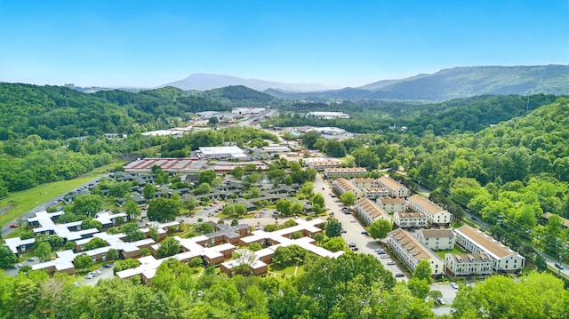aerial view featuring a mountain view and a forest view