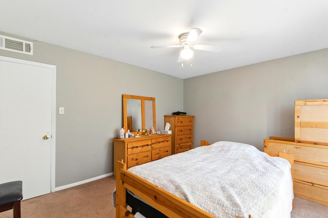 bedroom with ceiling fan, light colored carpet, and visible vents