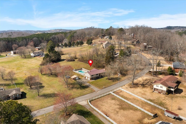 aerial view featuring a rural view and a view of trees