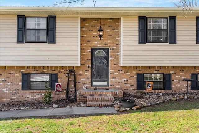 view of front of property featuring brick siding