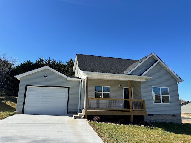 view of front of house with a garage, a front yard, and covered porch