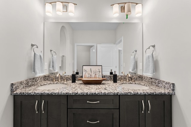 bathroom featuring double vanity and a sink