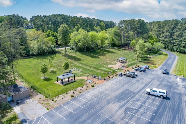 birds eye view of property with a view of trees