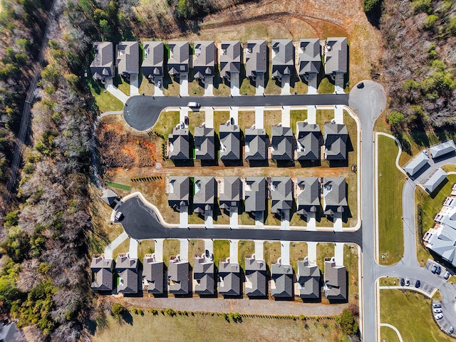 birds eye view of property with a residential view
