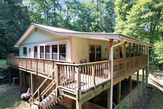 rear view of property with a wooden deck