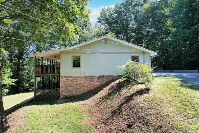 view of side of home featuring a yard