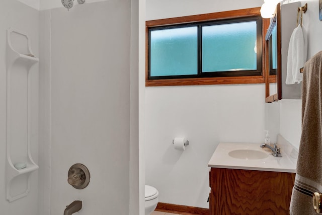 full bathroom with vanity,  shower combination, and toilet