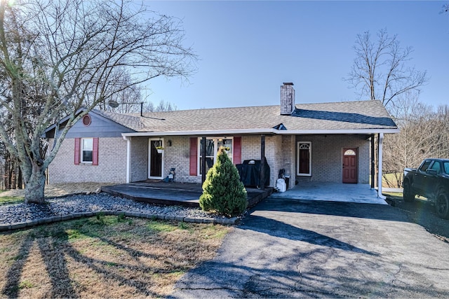 ranch-style house with a carport