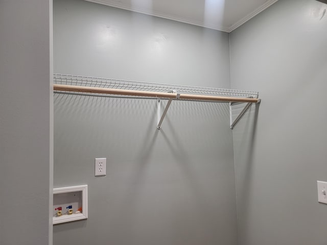 clothes washing area with hookup for a washing machine and crown molding