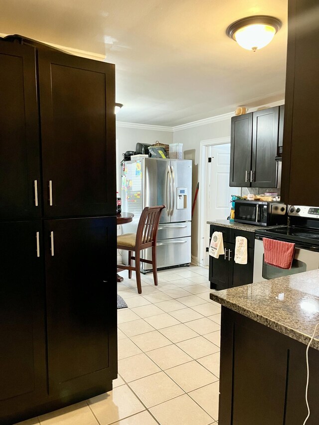 9 Edwards Ter, Chattanooga, TN 37412 - kitchen featuring stainless steel appliances, light tile patterned flooring, crown molding, and light stone countertops