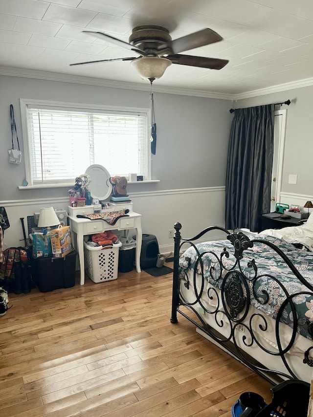 9 Edwards Ter, Chattanooga, TN 37412 - bedroom featuring multiple windows, ornamental molding, light wood finished floors, a wainscoted wall, and a ceiling fan
