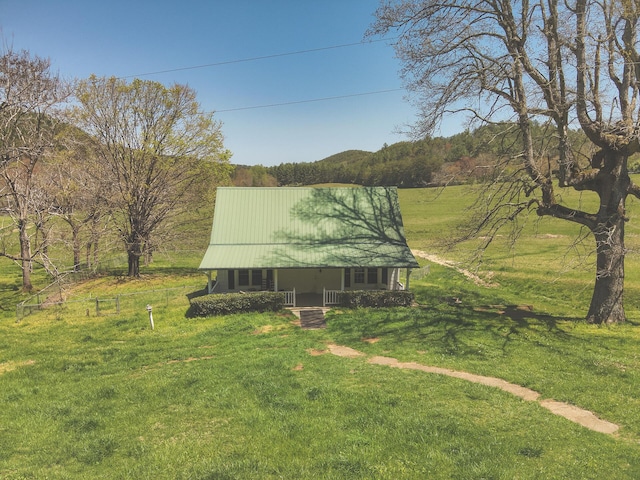 626 Brush Creek Rd, Copperhill, TN 37317 - exterior space with covered porch, a front yard, and metal roof