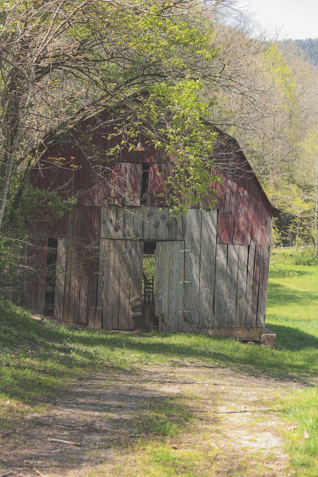 626 Brush Creek Rd, Copperhill, TN 37317 - view of barn with a yard and a view of trees
