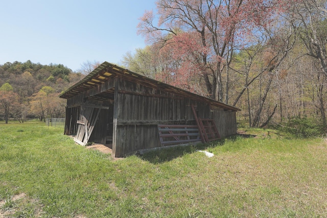 626 Brush Creek Rd, Copperhill, TN 37317 - view of pole building featuring a yard and a wooded view