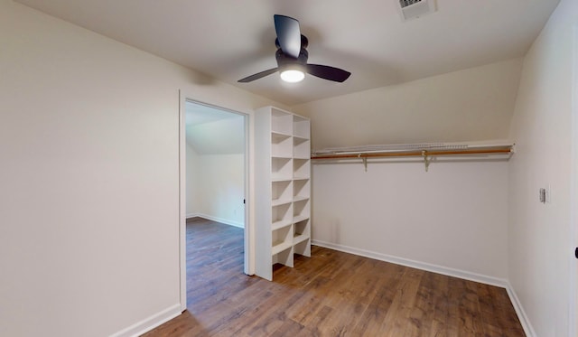 walk in closet featuring ceiling fan and hardwood / wood-style flooring