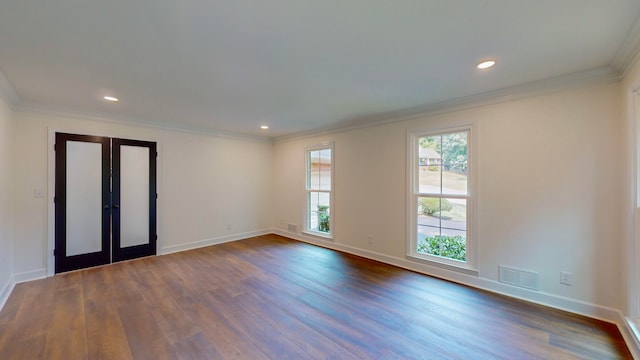 unfurnished room with dark wood-type flooring, ornamental molding, and french doors