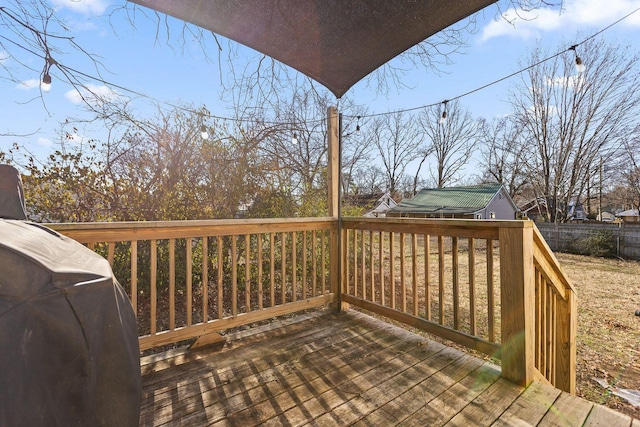 deck with fence and area for grilling