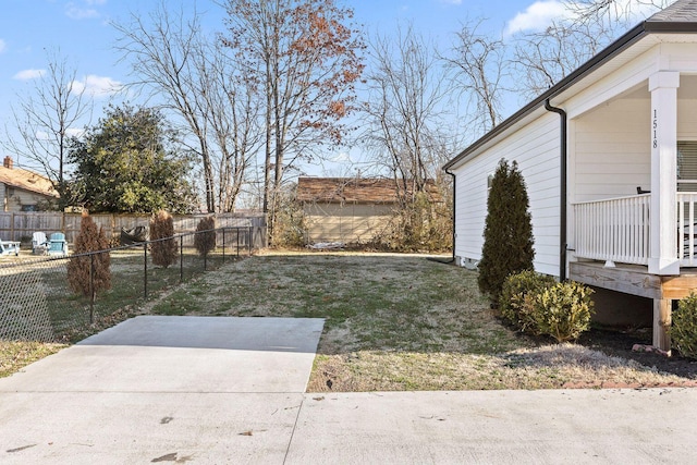 view of yard with fence and a patio