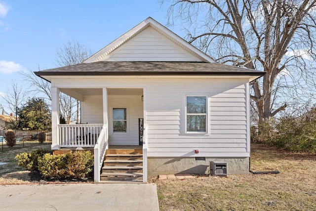 bungalow featuring covered porch, central AC, stairway, and roof with shingles