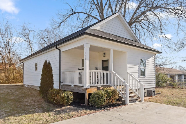 view of front of house featuring cooling unit and covered porch