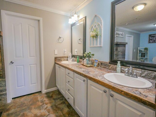 bathroom featuring a sink, a textured ceiling, and crown molding