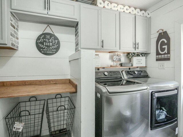 laundry area featuring cabinet space and independent washer and dryer