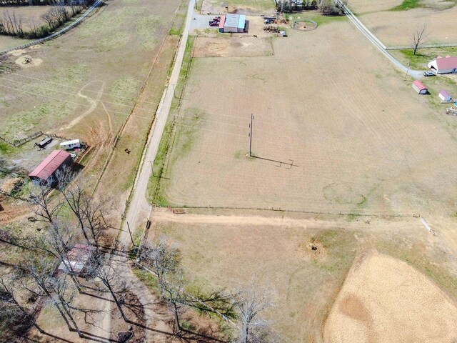 birds eye view of property featuring a rural view