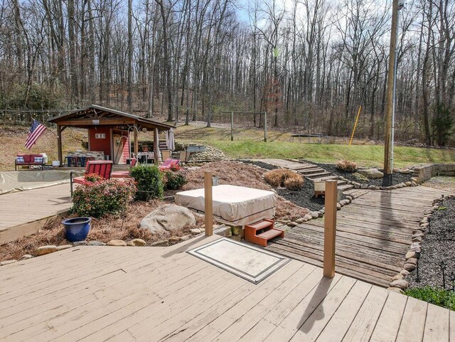 wooden deck featuring a wooded view