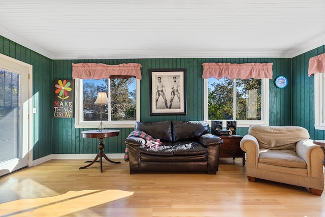 living room featuring hardwood / wood-style flooring and crown molding