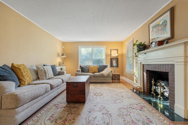 living room with a fireplace, wood-type flooring, and a textured ceiling