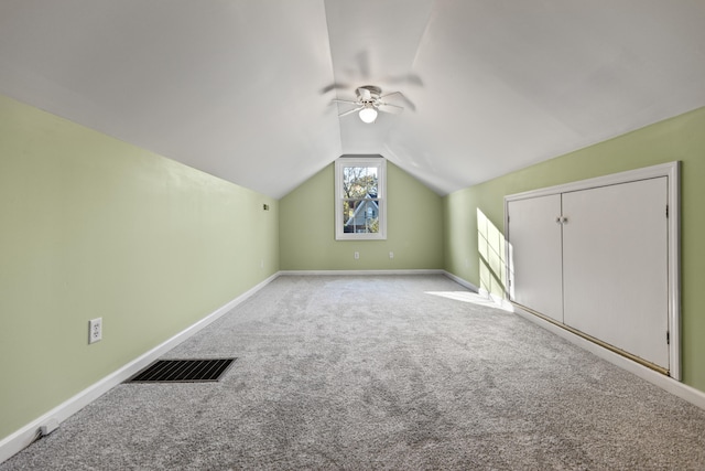 bonus room featuring light colored carpet, vaulted ceiling, and ceiling fan