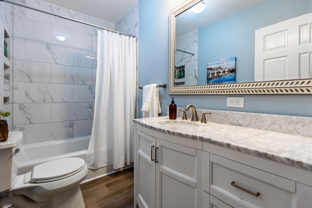 full bathroom featuring shower / bath combination with curtain, toilet, wood-type flooring, and vanity