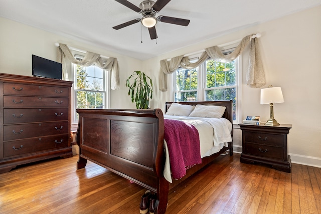 bedroom with ceiling fan and hardwood / wood-style flooring