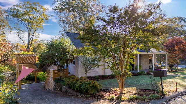 view of side of home with a lawn