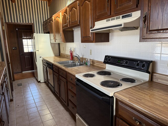 kitchen with black dishwasher, electric stove, light countertops, a sink, and under cabinet range hood