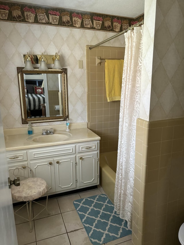 full bathroom featuring tile patterned floors, vanity, and shower / bath combination with curtain
